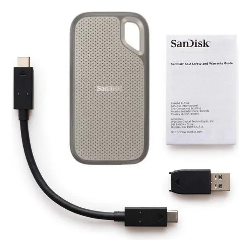 SanDisk external hard drive with cables and safety guide on a white background